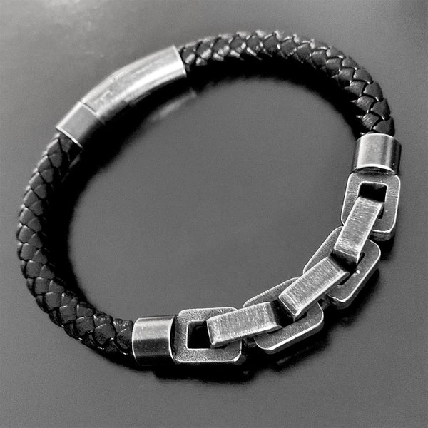 Pulsera negra con eslabón de acero
