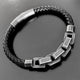 Pulsera negra con eslabón de acero