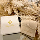 White box with Gold Logo an stamped leather Bag Inside.